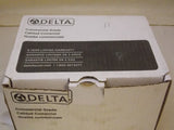 Delta 21C144 Commercial 4 pulgadas. Grifo de baño central con 2 manijas, cromo pulido